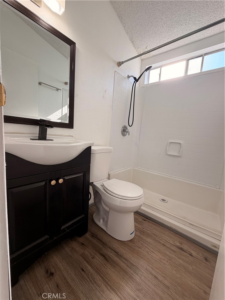 16511 Garfield Avenue, Unit D40 Paramount, CA 90723 - Photo 10 of 18 a bathroom with a sink toilet and shower
