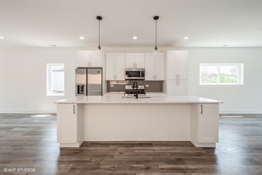 4243 South Princeton Avenue Chicago, IL 60609 - Photo 6 of 6 a view of kitchen with stainless steel appliances granite countertop cabinets and window