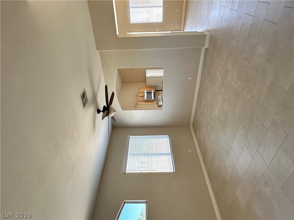 1922 Thunder Ridge Circle Henderson, NV 89012 - Photo 6 of 27 Tall ceilings and abundant natural light create an open, airy living space.