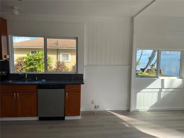 a kitchen with a sink and a window