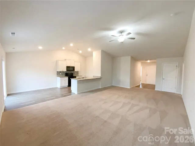 a view of a kitchen with a sink and a chandelier