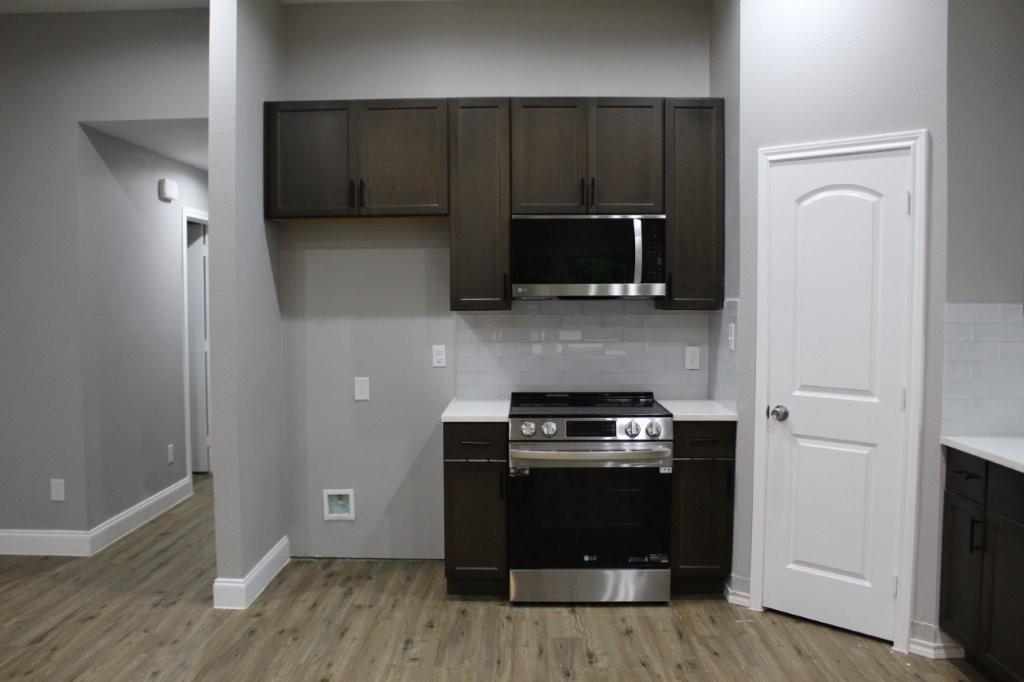 125 Chapperall Drive Mabank, TX 75156 - Photo 10 of 11 a kitchen with a stove and a microwave
