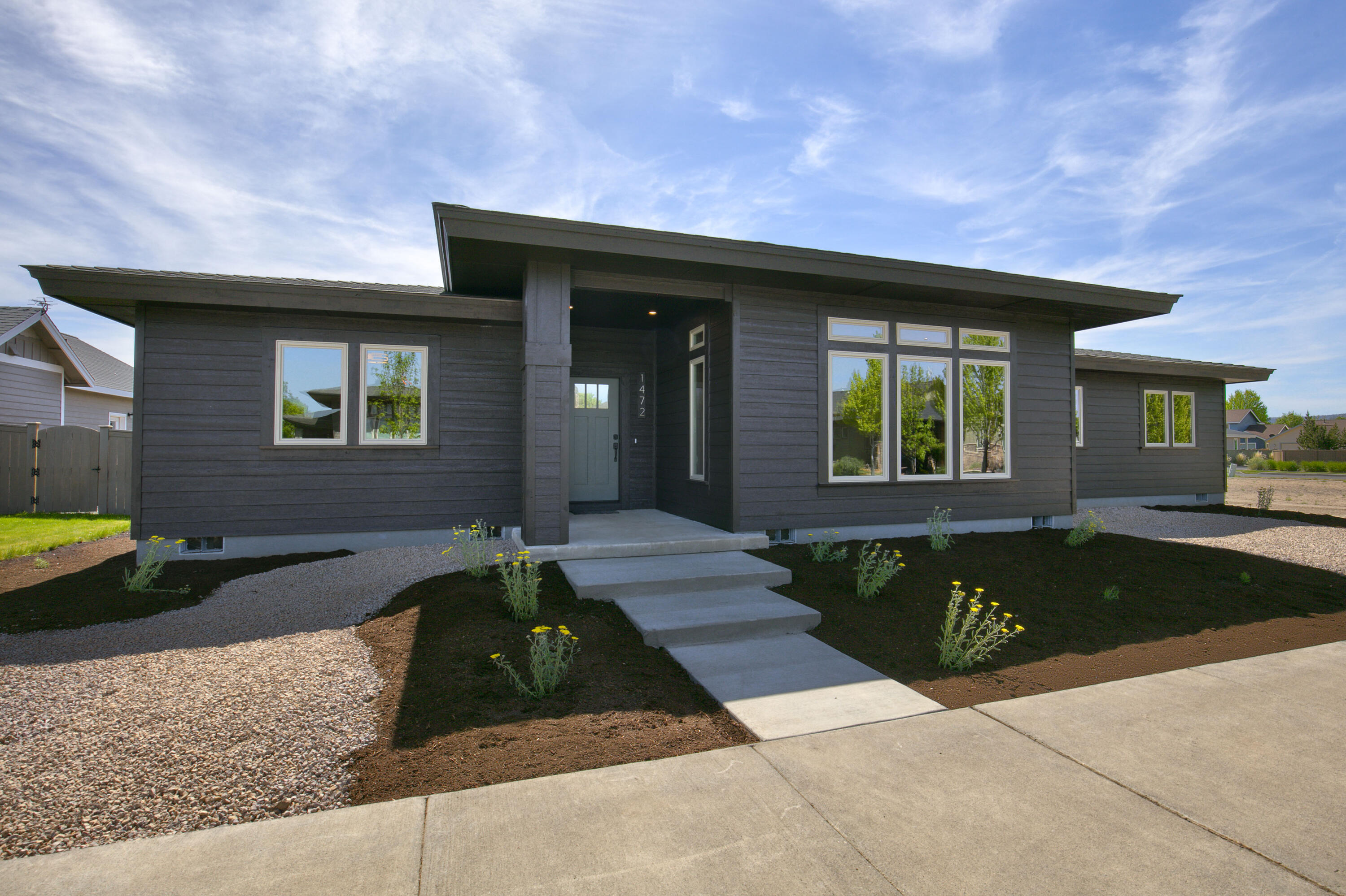 1472 Northeast Hudspeth Road Prineville, OR 97754 - Photo 4 of 26 a front view of a house with a yard