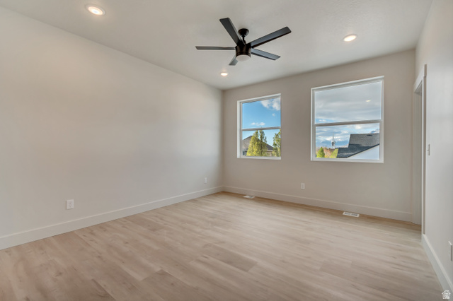 2535 West Santa Fe Drive Mapleton, UT 84664 - Photo 21 of 26 Unfurnished room with light wood-style floors, a ceiling fan, and recessed lighting