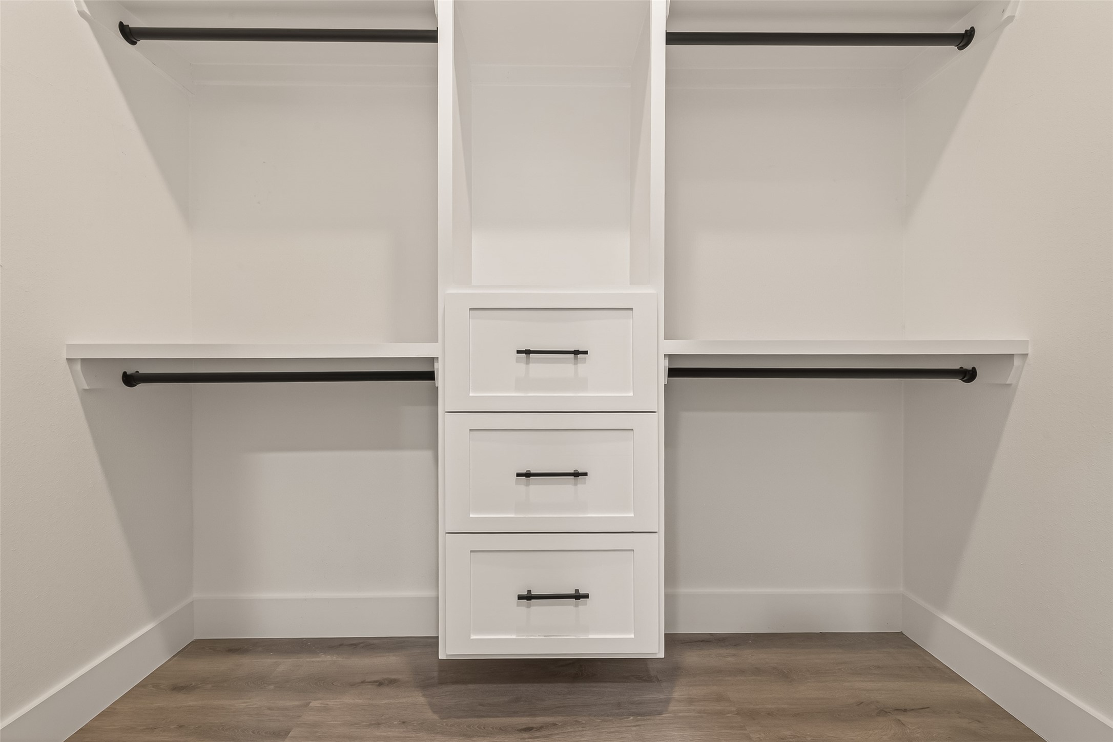 6750 Sands Point Drive Houston, TX 77074 - Photo 27 of 39 Primary bedroom walk in closet with custom drawers and shelves.
