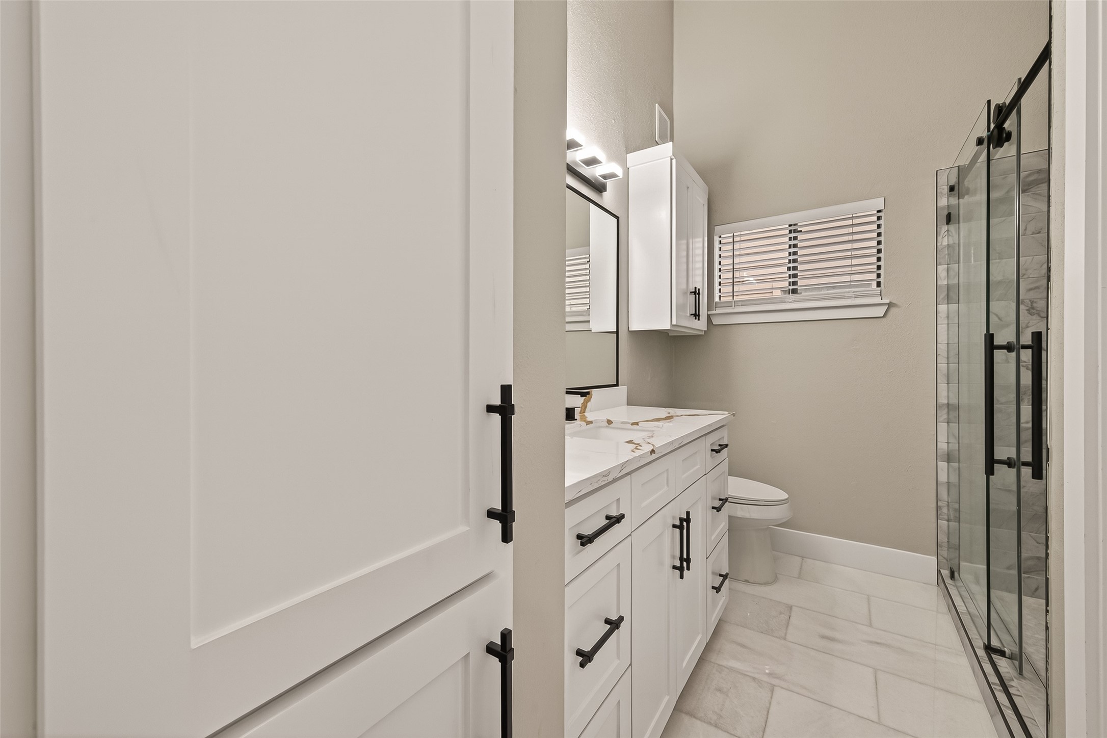 6750 Sands Point Drive Houston, TX 77074 - Photo 28 of 39 a bathroom with a sink a toilet and a shower
