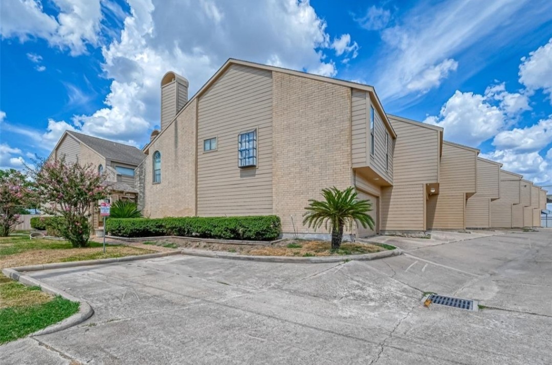 6750 Sands Point Drive Houston, TX 77074 - Photo 37 of 39 a front view of a house with a garden