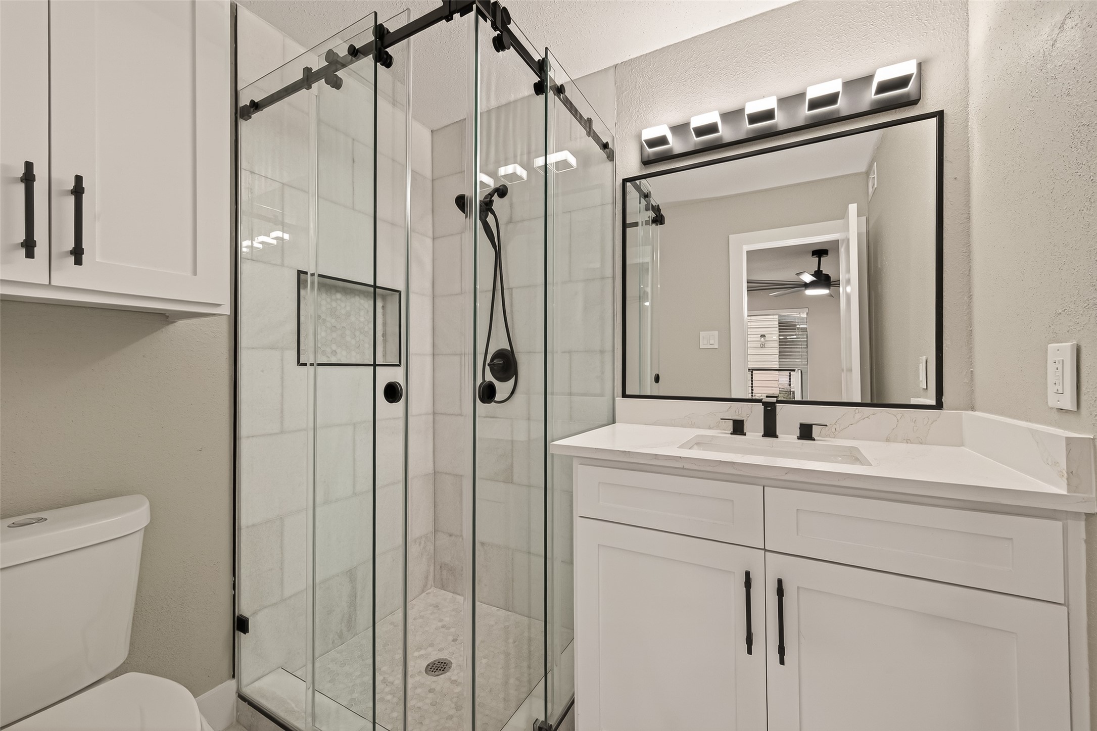 6750 Sands Point Drive Houston, TX 77074 - Photo 9 of 39 Custom walk in shower with seamless glass doors.