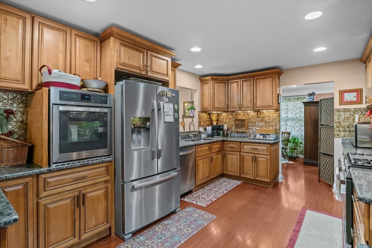 307 Crestview Drive Dickson, TN 37055 - Photo 11 of 61 a kitchen with stainless steel appliances granite countertop a refrigerator stove and cabinets