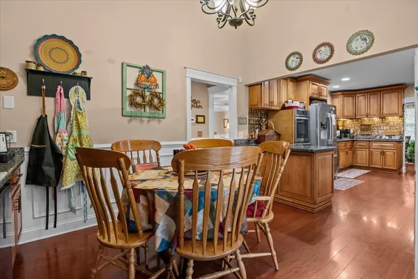 a view of a dining room with furniture and wooden floor