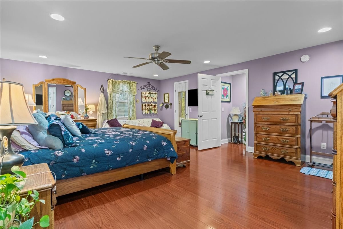 307 Crestview Drive Dickson, TN 37055 - Photo 17 of 61 a spacious bedroom with a bed and wooden floor