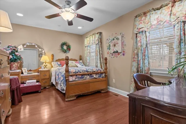 a bedroom with furniture and a window