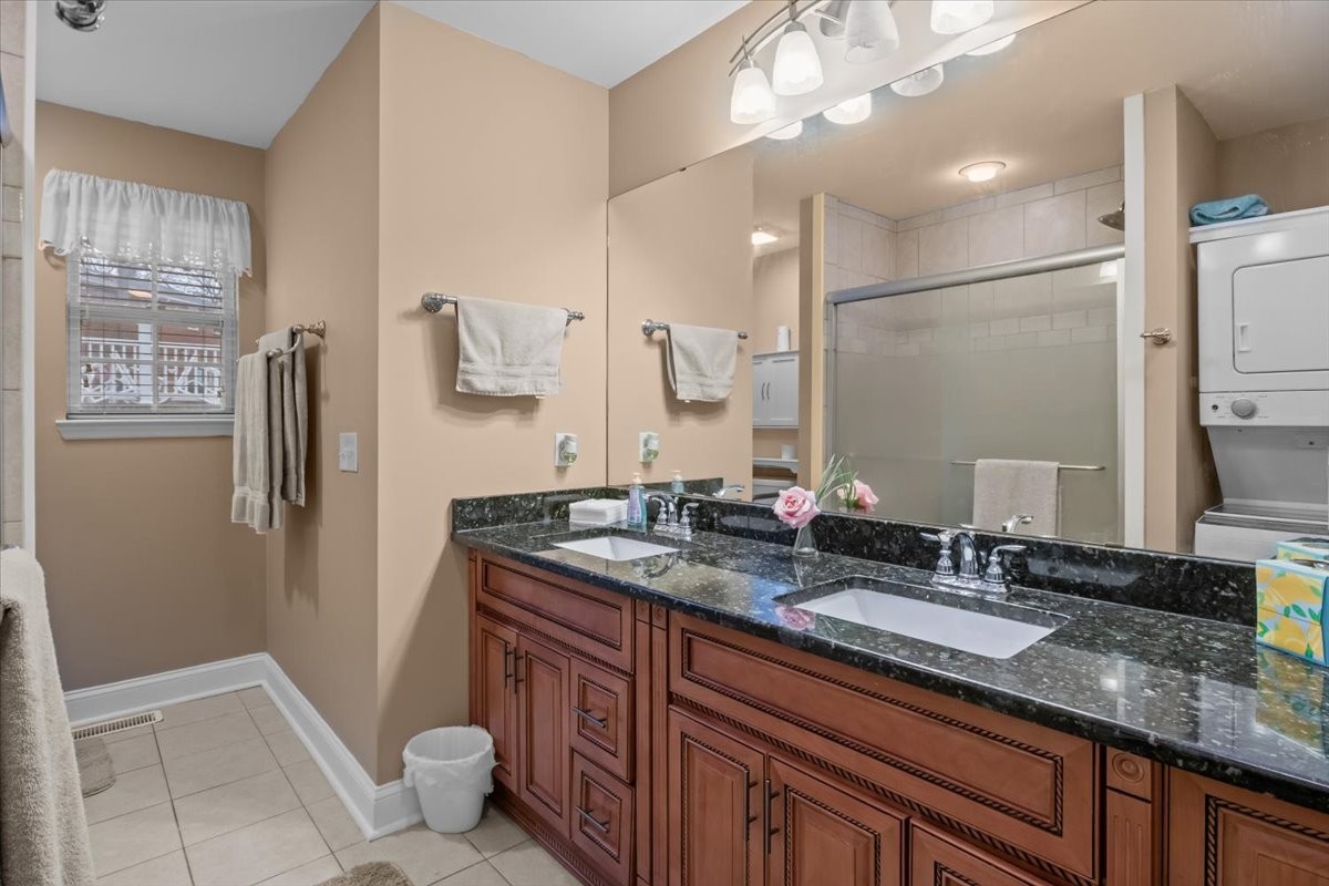 307 Crestview Drive Dickson, TN 37055 - Photo 24 of 61 a bathroom with a granite countertop sink a toilet a mirror and shower