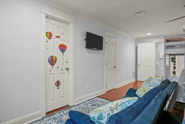 a living room with kitchen island furniture and a wooden floor