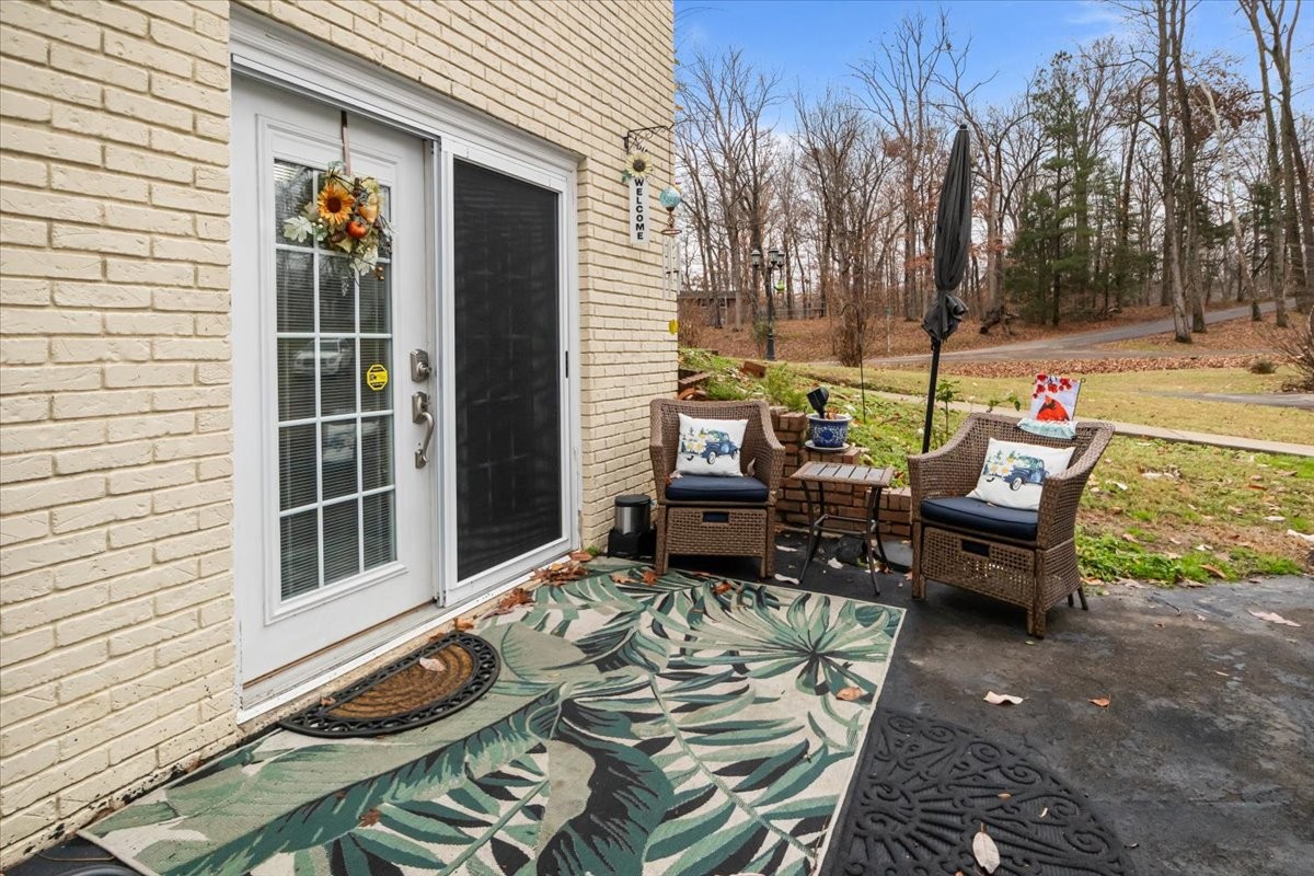 307 Crestview Drive Dickson, TN 37055 - Photo 36 of 61 a view of a patio with a dining table and chairs with wooden floor and fence
