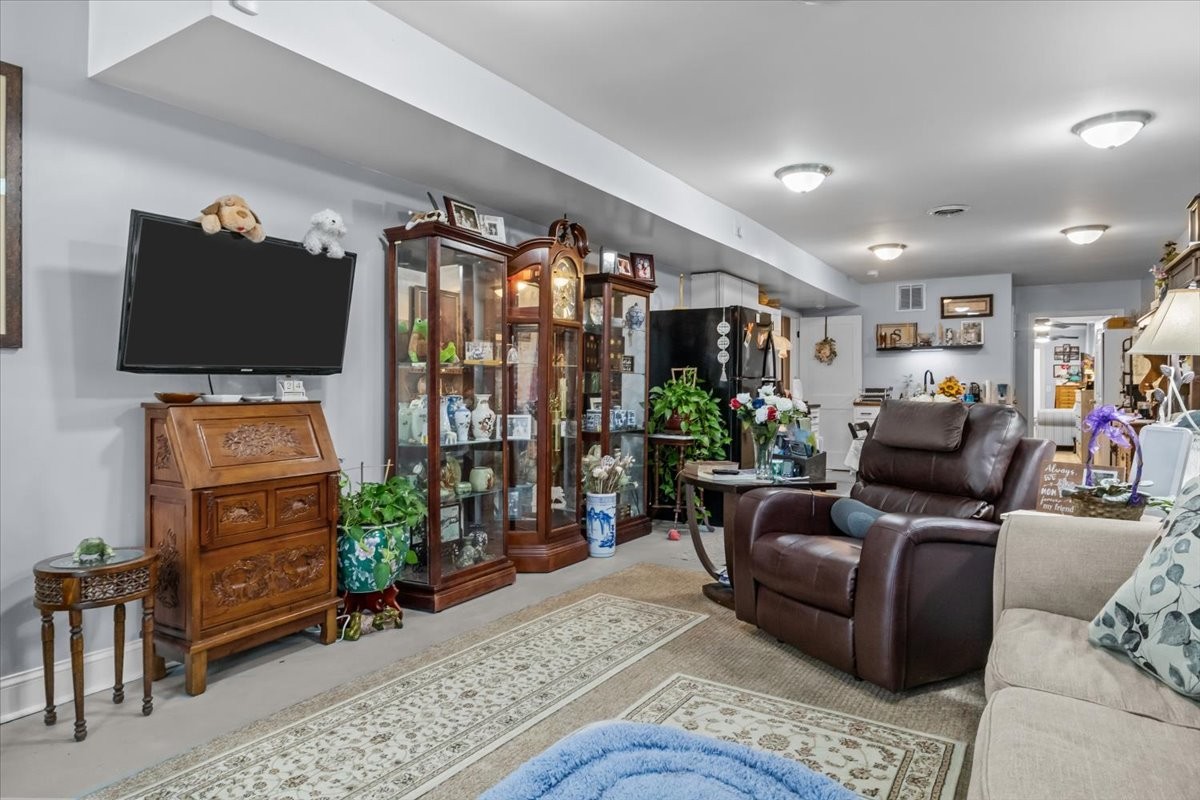 307 Crestview Drive Dickson, TN 37055 - Photo 37 of 61 a living room with furniture and a flat screen tv