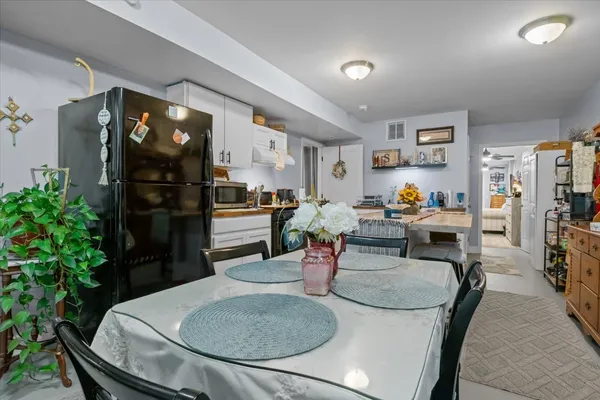 a bedroom with bed and a chandelier