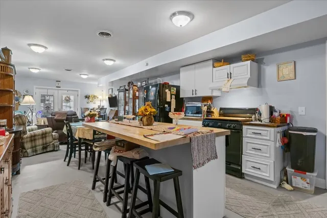 a view of a workspace with furniture