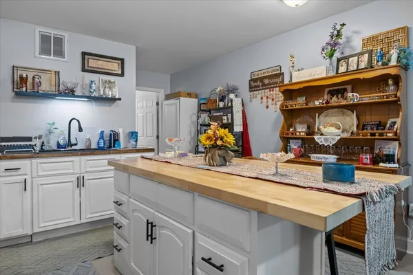 a view of a storage room with water heater and racks