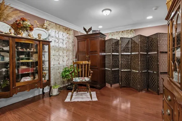 a room with lots of wooden furniture and a shower