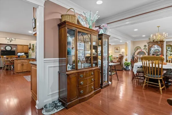 a view of a dining room with furniture window and wooden floor