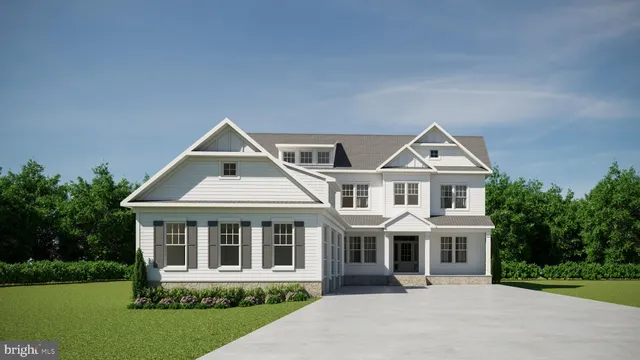 a view of a white house with a yard and plants