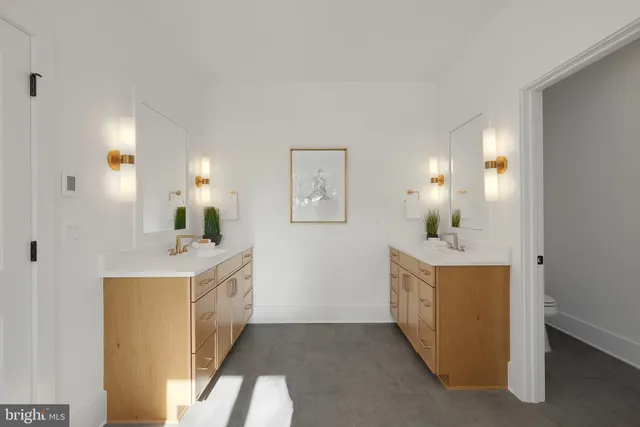 a bedroom with furniture and a large window