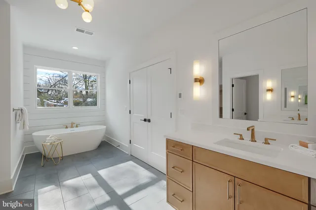 a view of a kitchen with cabinets and wooden floor