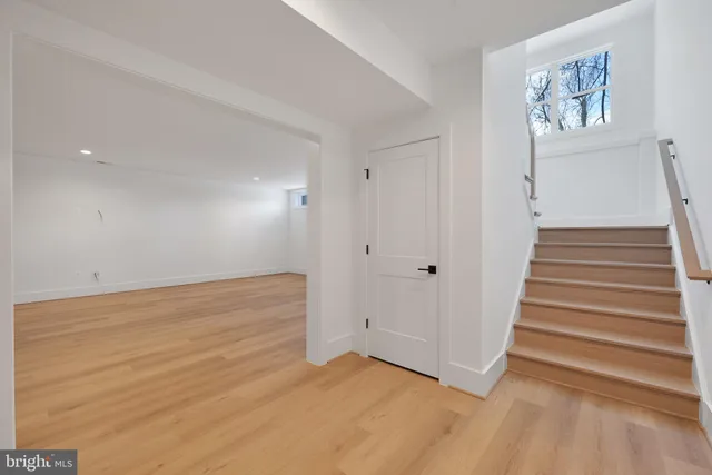 a bathroom with a sink a toilet a mirror a vanity and shower