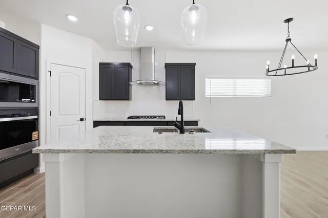 a bathroom with a granite countertop sink mirror and double