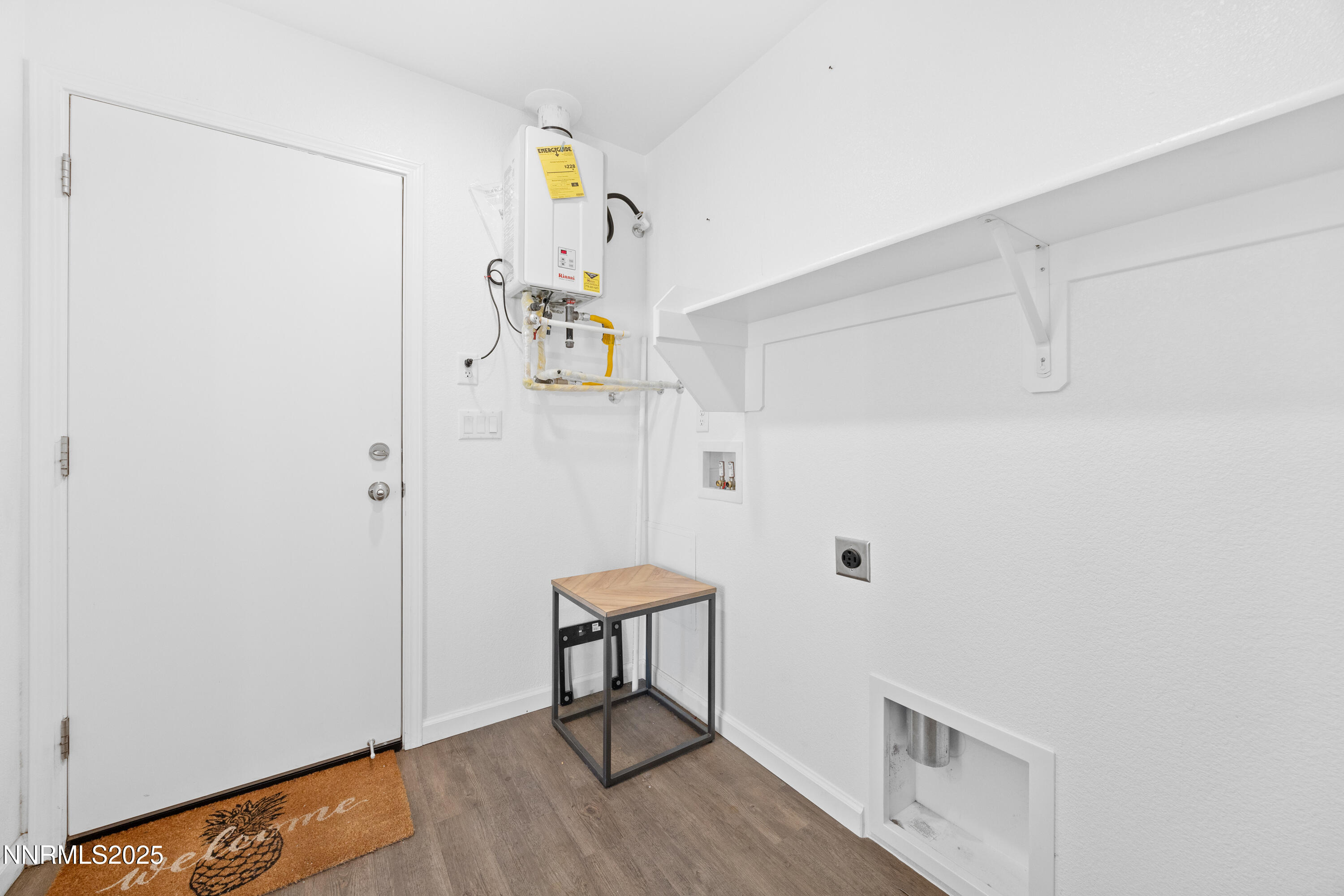 737 Valmy Drive Reno, NV 89506 - Photo 12 of 14 a view of a hallway with wooden floor and a potted plant