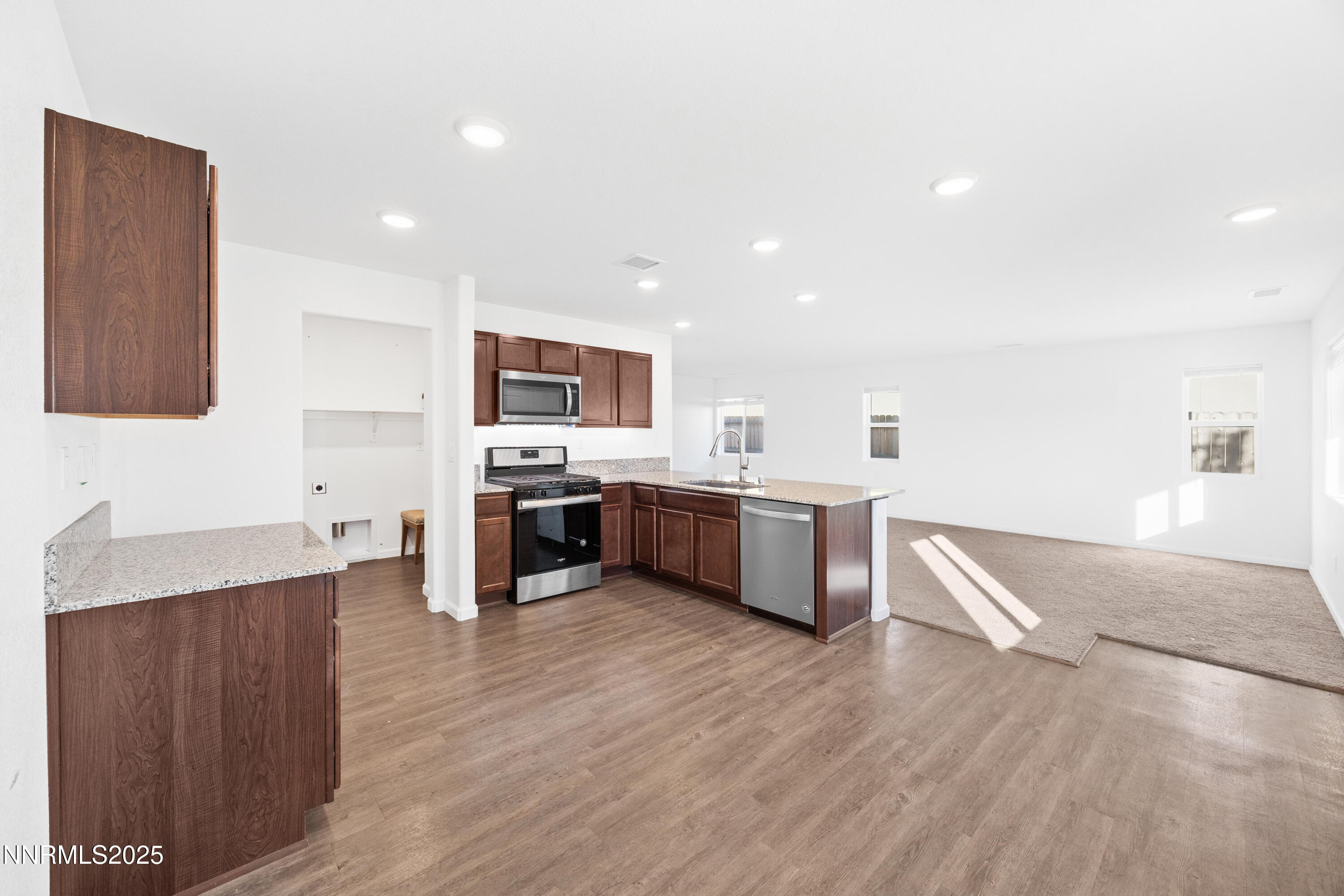 737 Valmy Drive Reno, NV 89506 - Photo 4 of 14 a kitchen with a sink cabinets and wooden floor