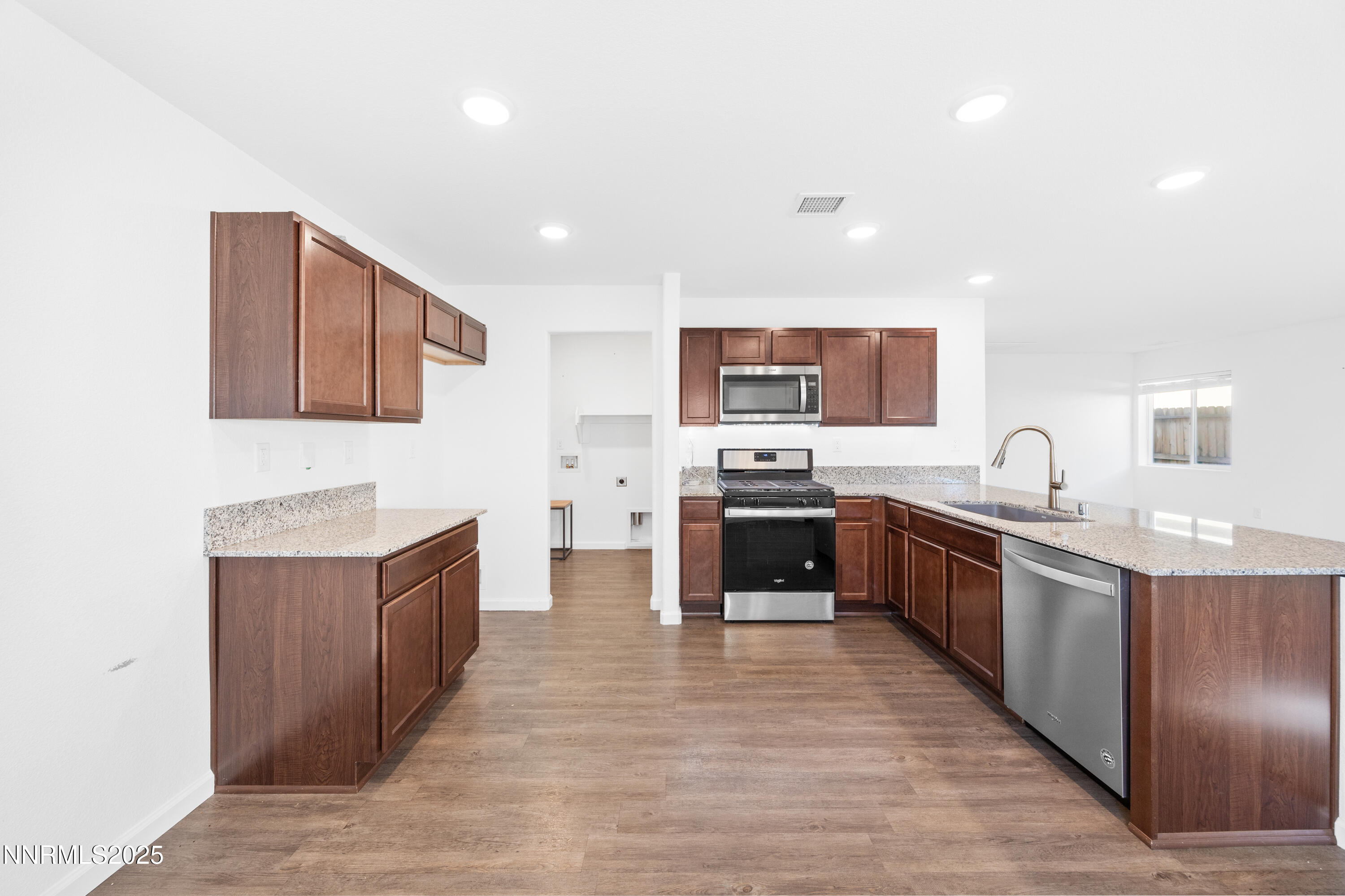 737 Valmy Drive Reno, NV 89506 - Photo 5 of 14 a large kitchen with stainless steel appliances lots of counter top space