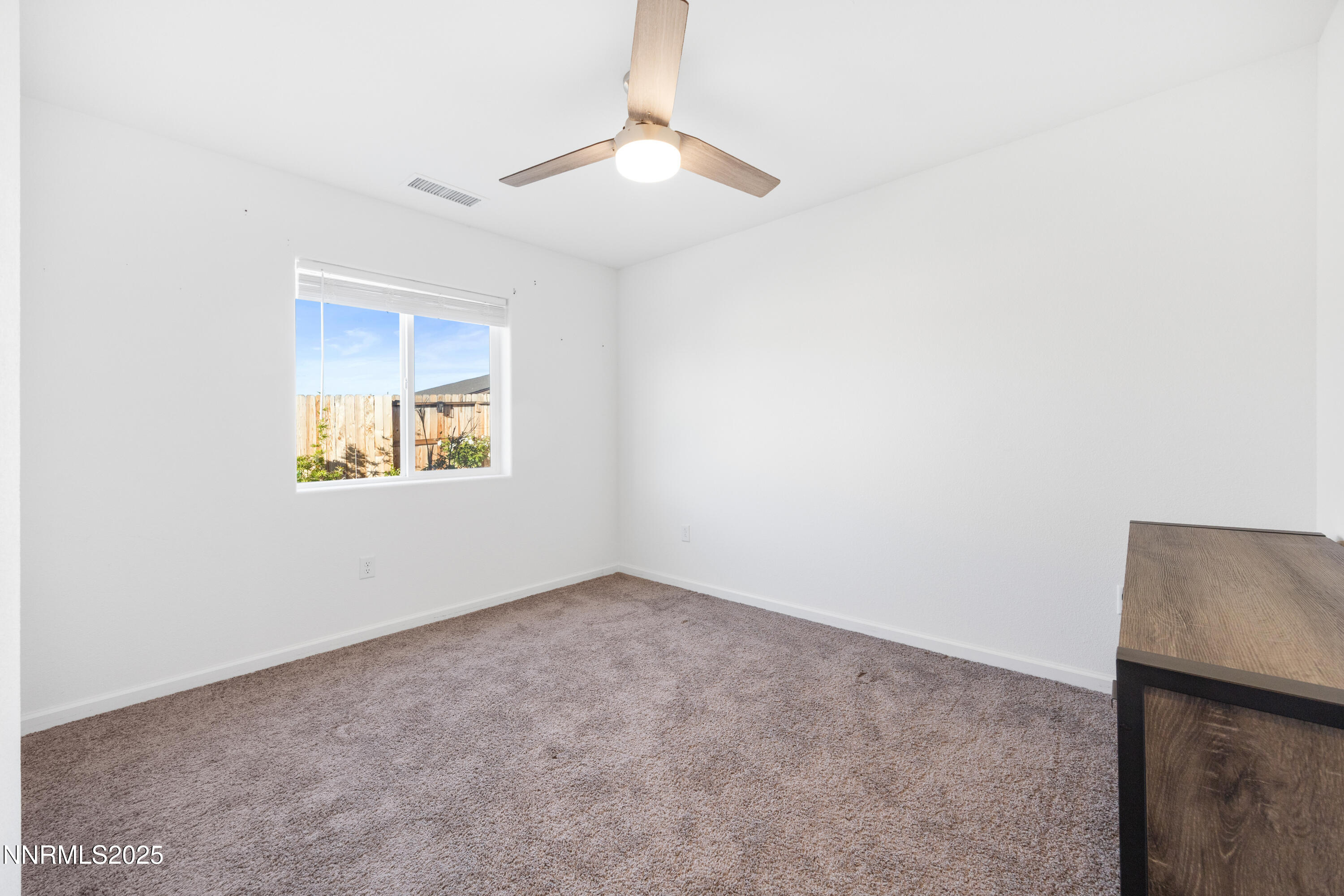 737 Valmy Drive Reno, NV 89506 - Photo 7 of 14 an empty room with a window
