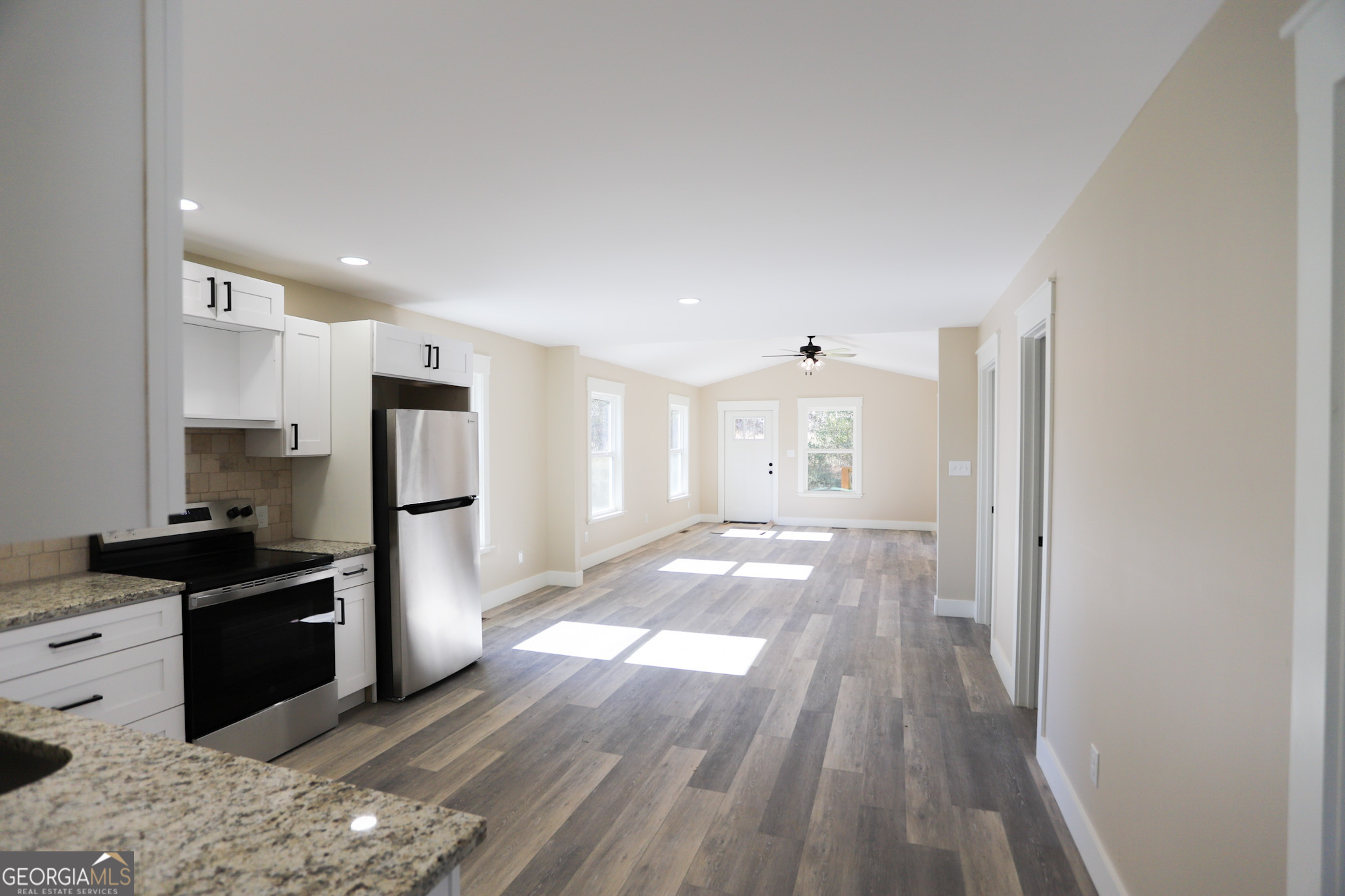 96 Orchard Road Summerville, GA 30747 - Photo 13 of 23 a kitchen with stainless steel appliances granite countertop a refrigerator and a sink