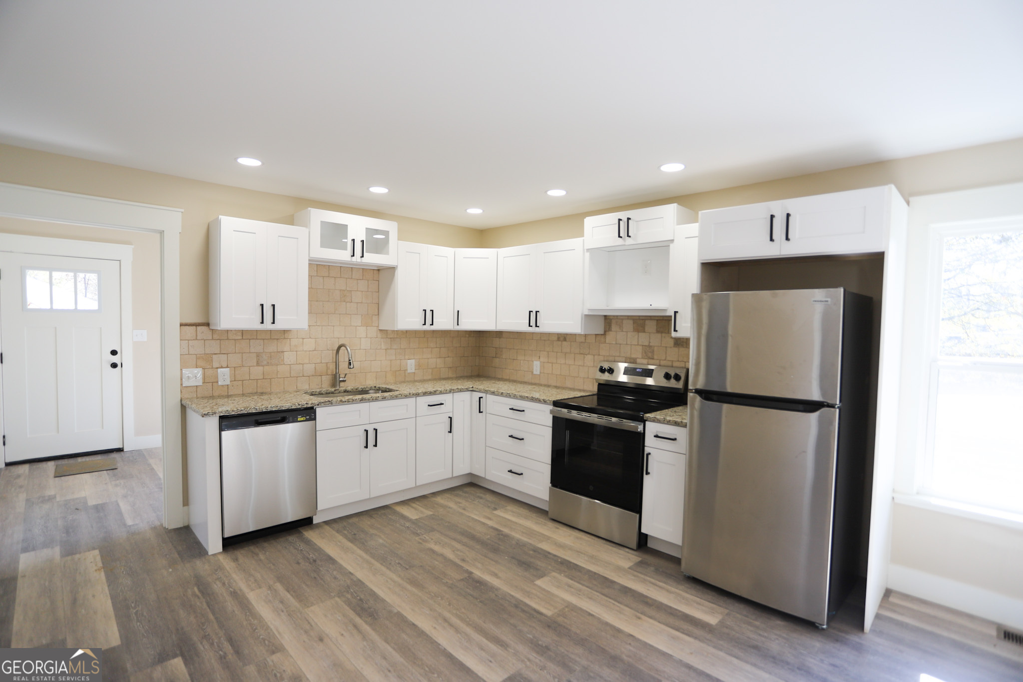 96 Orchard Road Summerville, GA 30747 - Photo 16 of 23 a kitchen with granite countertop a refrigerator stove top oven and sink