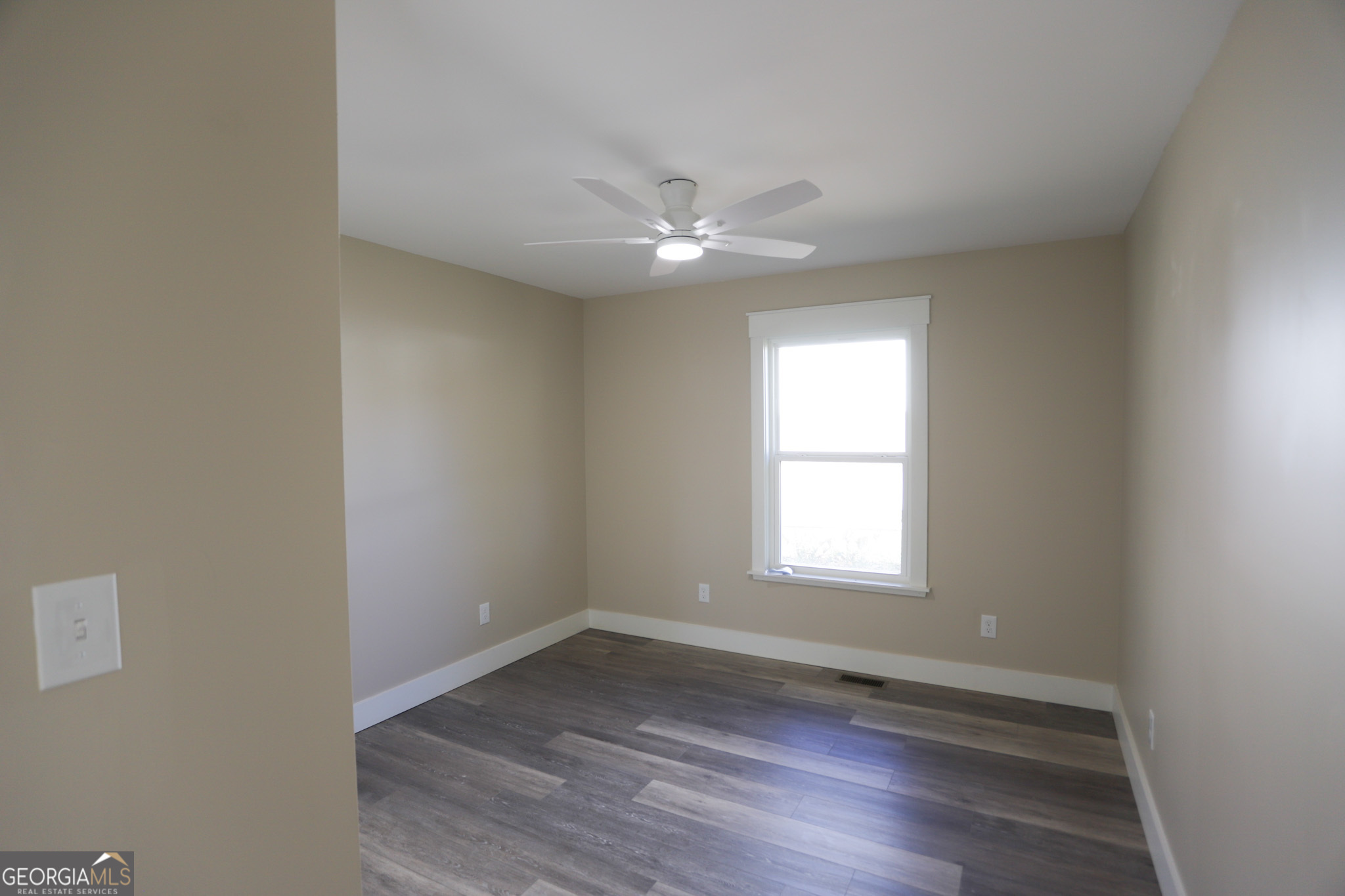 96 Orchard Road Summerville, GA 30747 - Photo 18 of 23 an empty room with wooden floor and windows