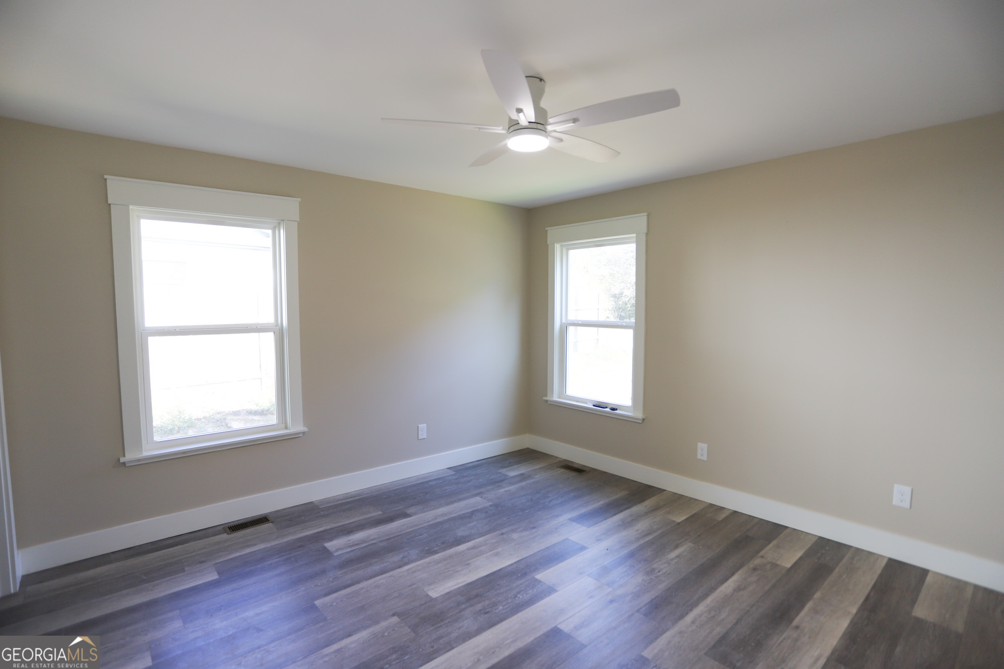 96 Orchard Road Summerville, GA 30747 - Photo 20 of 23 a view of an empty room with a window and wooden floor