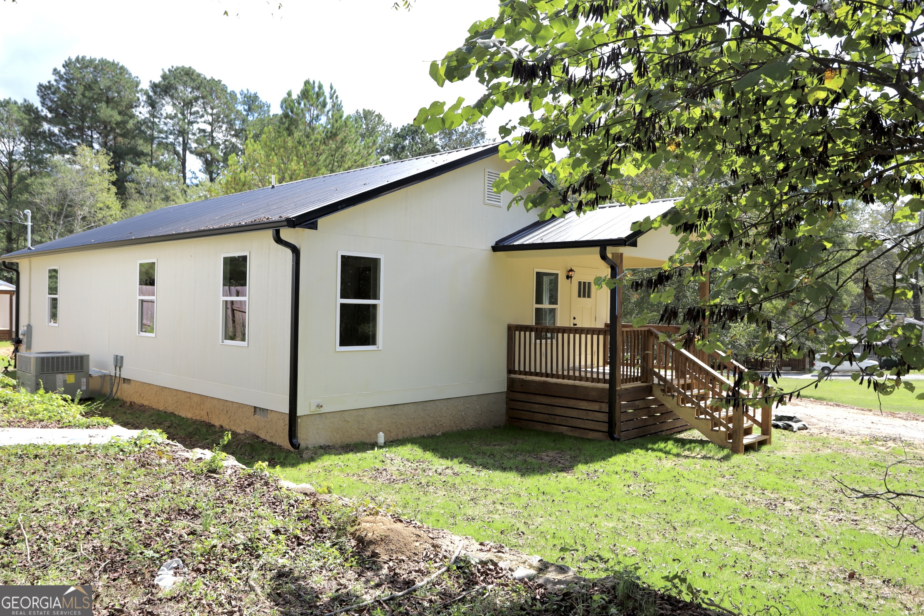 96 Orchard Road Summerville, GA 30747 - Photo 2 of 23 a front view of a house with garden