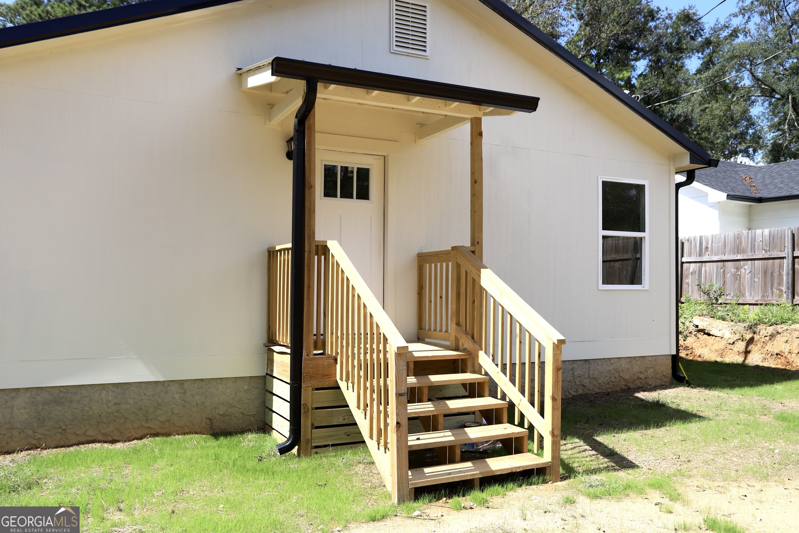 96 Orchard Road Summerville, GA 30747 - Photo 7 of 23 a view of a house with a yard and stairs