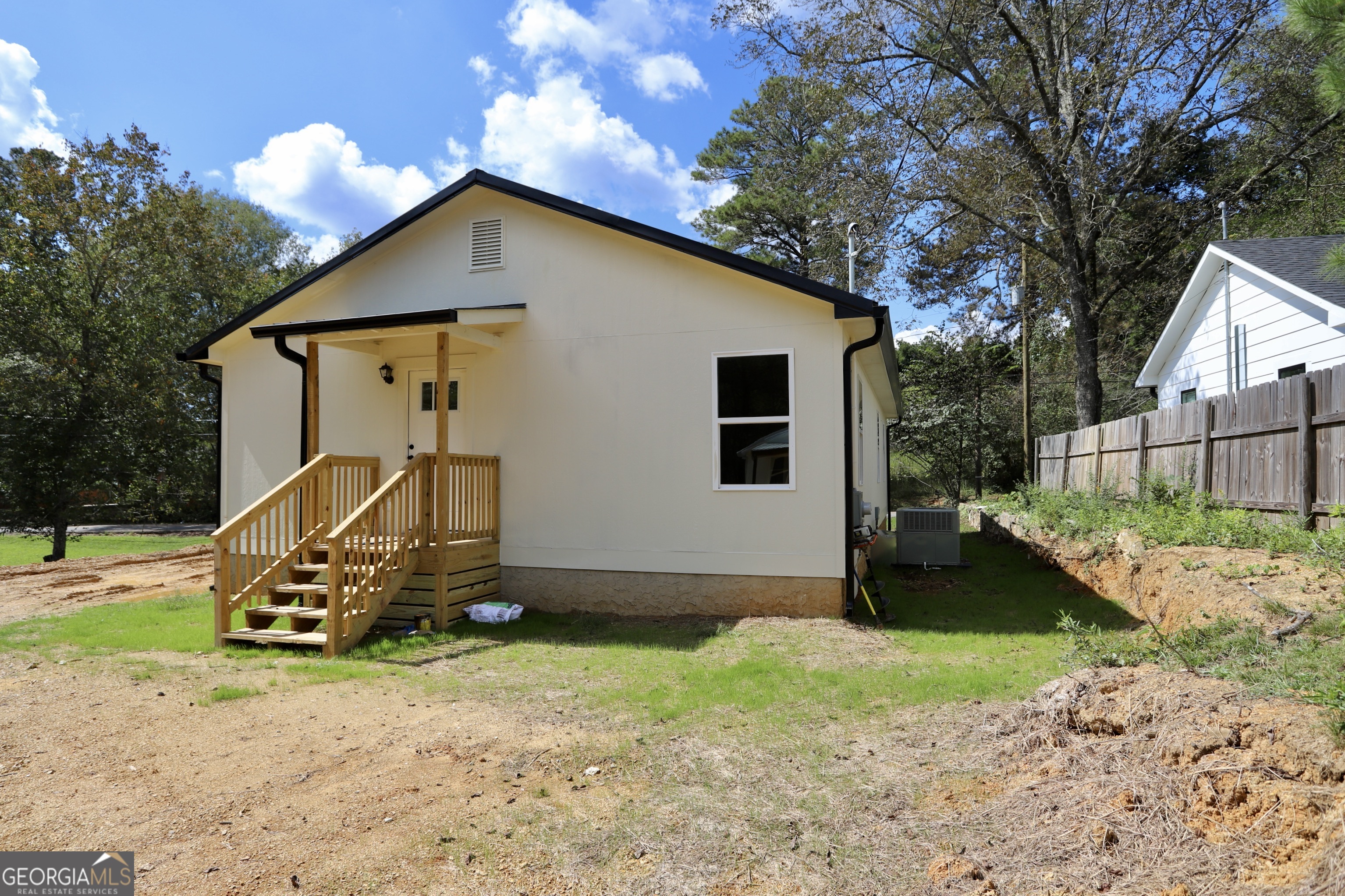 96 Orchard Road Summerville, GA 30747 - Photo 8 of 23 a front view of a house with garden