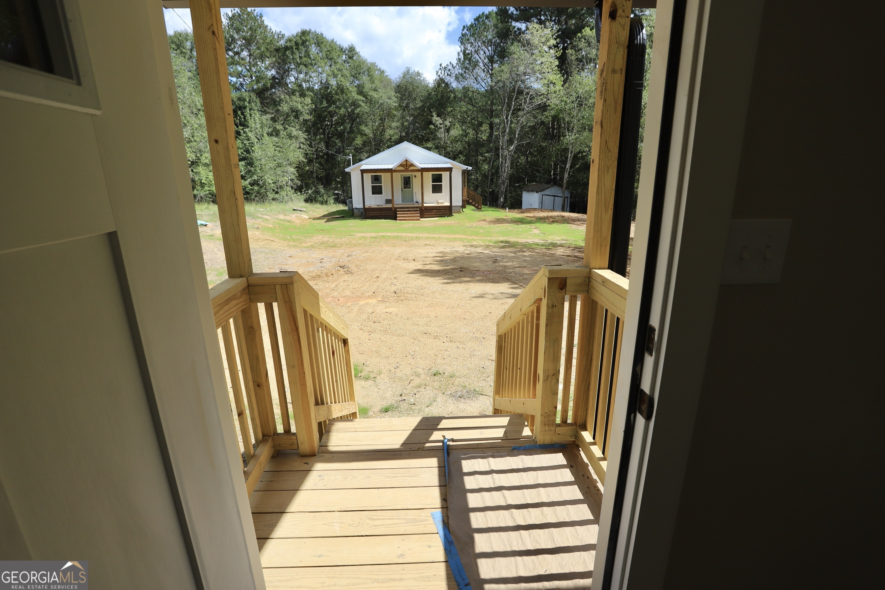 96 Orchard Road Summerville, GA 30747 - Photo 9 of 23 a view of a bedroom with wooden floor and stairs
