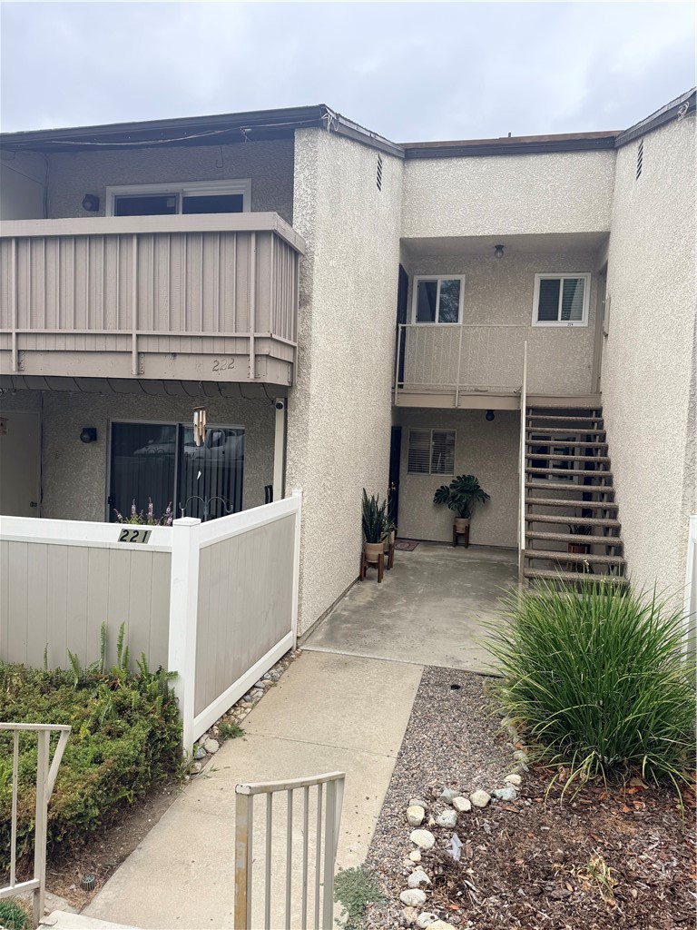 8990 19th Street, Unit 222 Rancho Cucamonga, CA 91701 - Photo 1 of 8 a view of a house with a yard