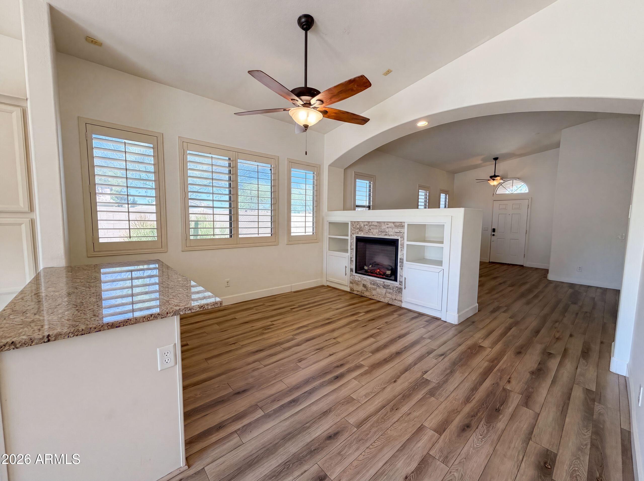 3951 East Timberline Road Gilbert, AZ 85297 - Photo 11 of 28 a view of empty room with wooden floor and fan