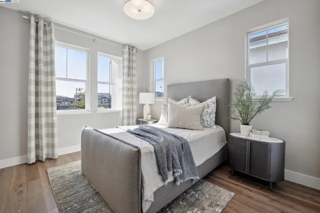 a bedroom with bed and a window