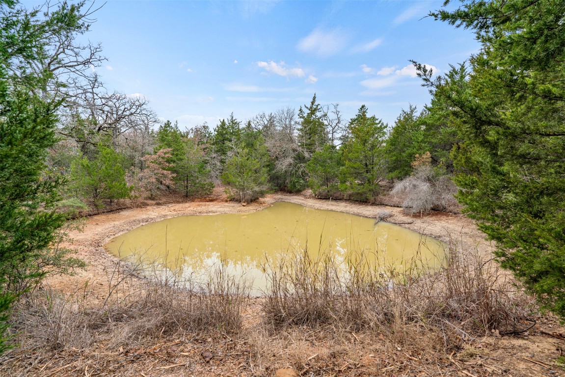 330 County Road 330 Milano, TX 76556 - Photo 2 of 14 a view of a swimming pool with an outdoor space and seating area