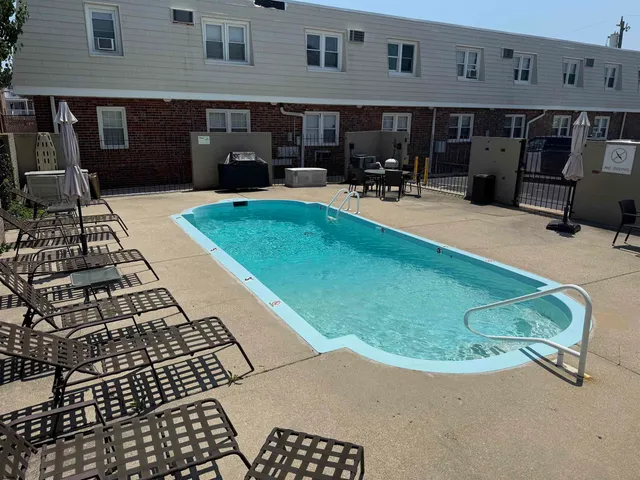 a view of a backyard with furniture
