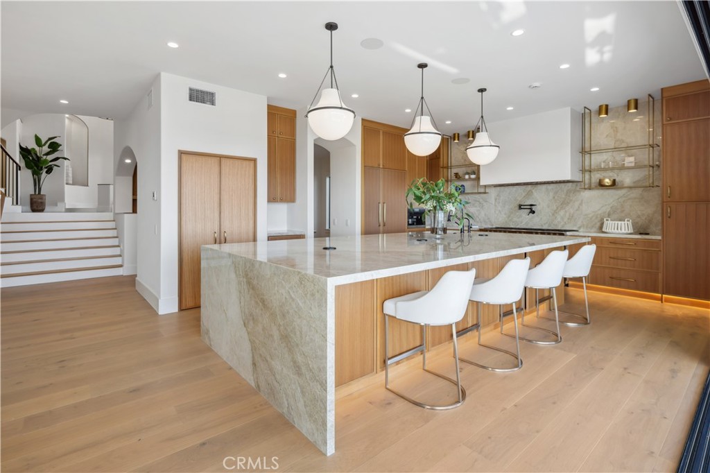 2915 Cliff Drive Newport Beach, CA 92663 - Photo 18 of 69 a kitchen with a table and chairs in it