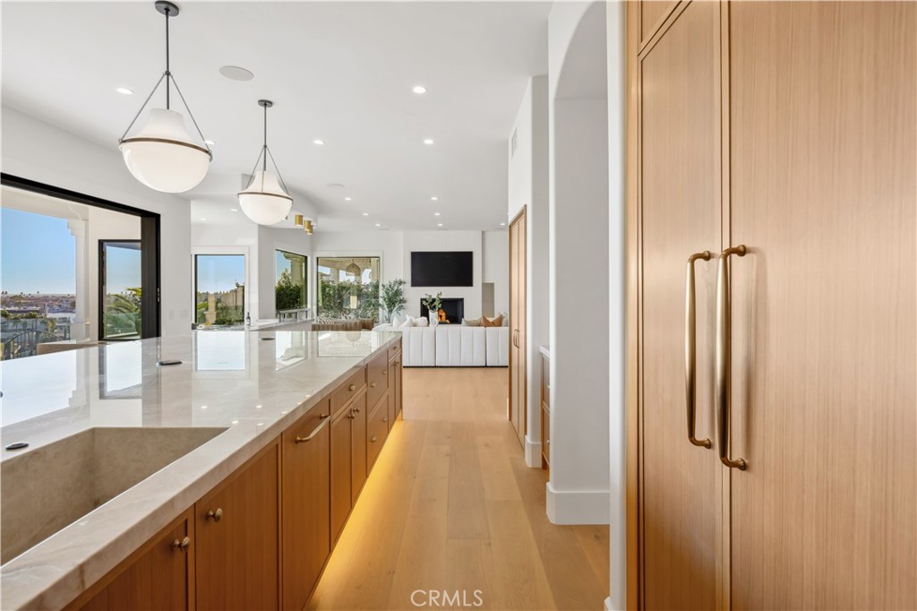 2915 Cliff Drive Newport Beach, CA 92663 - Photo 20 of 69 a view of a kitchen with a sink and wooden floor