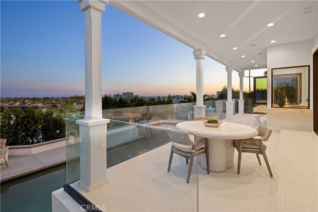 2915 Cliff Drive Newport Beach, CA 92663 - Photo 27 of 69 a view of a patio with a table and chairs